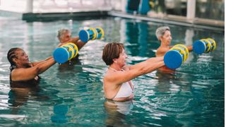 Women doing aquarobics, one of the exercises for weight loss recommended by Dr Hilary Jones, in a swimming pool with light foam weights