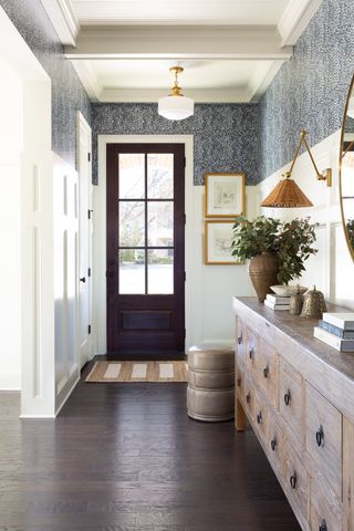 entryway with wallpaper and white panelling Prescott Design