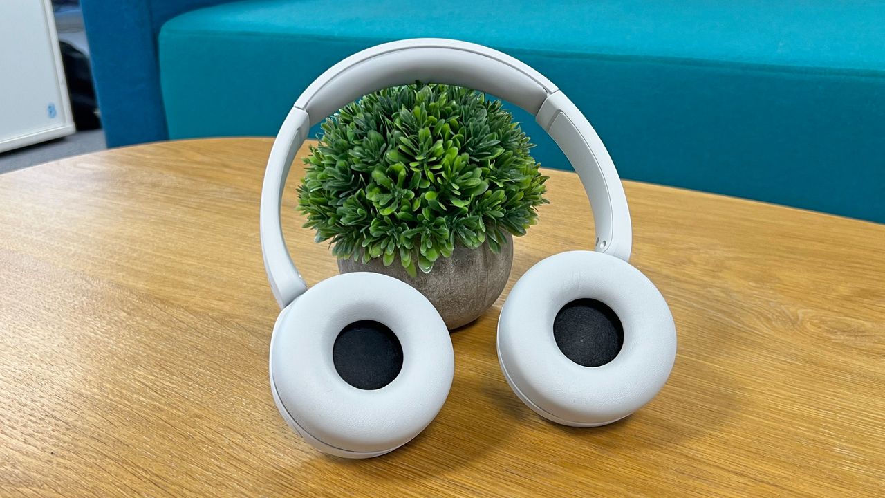 Sony WH-CH520 headphones on a wooden table