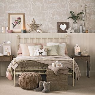 bedroom with bed with cushions and bedside table