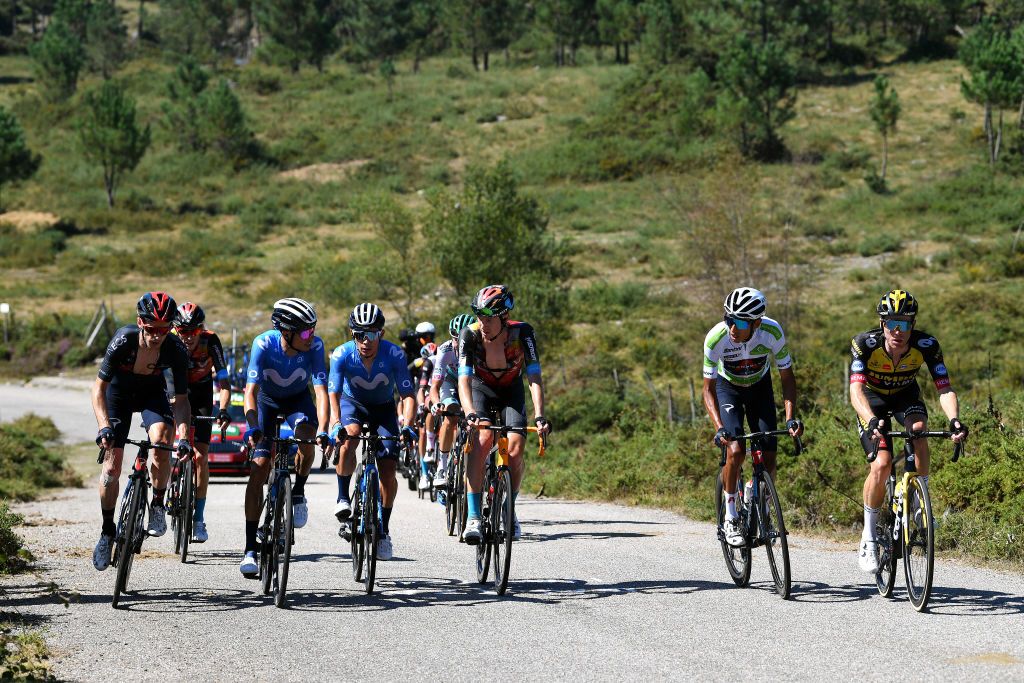 MOS SPAIN SEPTEMBER 04 LR Adam Yates of United Kingdom and Team INEOS Grenadiers Gino Mder of Switzerland and Team Bahrain Victorious Enric Mas Nicolau of Spain and Movistar Team Miguel ngel Lpez Moreno of Colombia and Movistar Team Jack Haig of Australia and Team Bahrain Victorious Egan Arley Bernal Gomez of Colombia and Team INEOS Grenadiers white best young jersey and Steven Kruijswijk of Netherlands and Team Jumbo Visma compete in the chase group during the 76th Tour of Spain 2021 Stage 20 a 2022km km stage from Sanxenxo to Mos Alto Castro de Herville 502m lavuelta LaVuelta21 on September 04 2021 in Mos Spain Photo by Tim de WaeleGetty Images