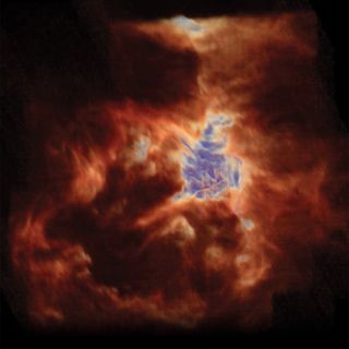 a gaseous orange and red nebula blazes in space