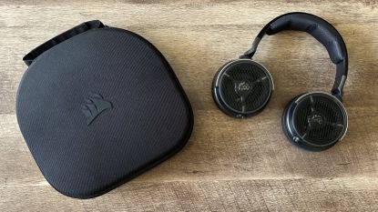 Corsair Virtuoso Pro headset and case on a wooden table