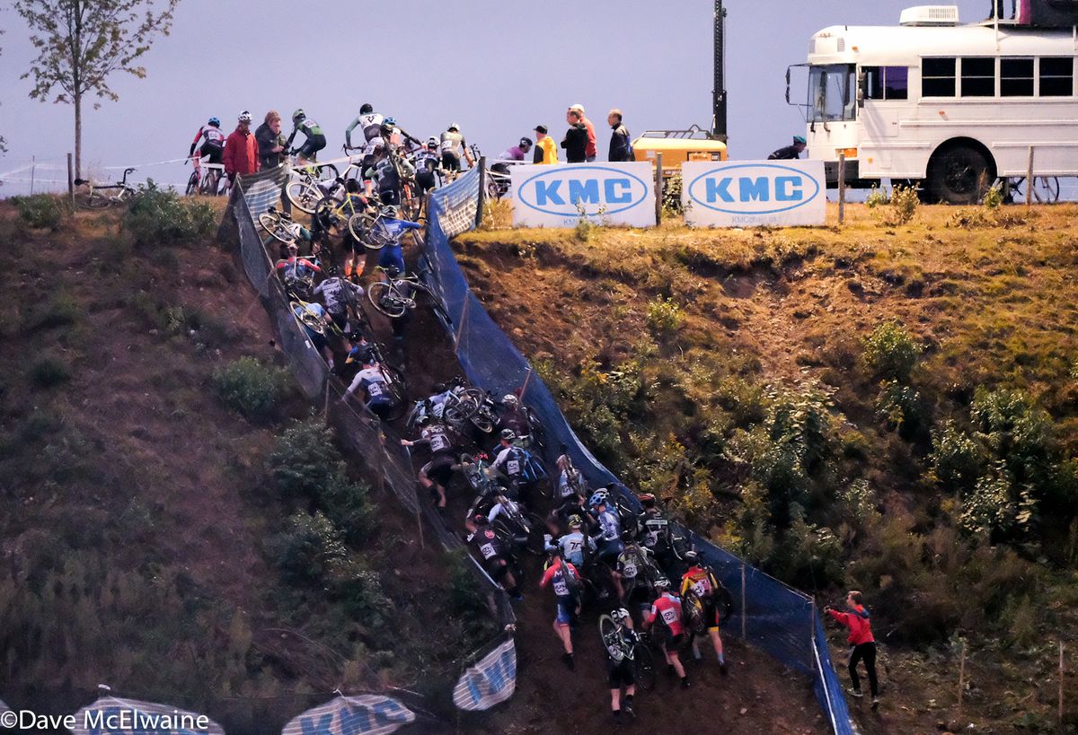 The Elite men scrambling up the steep run-up early in the race