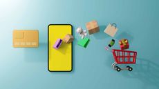 tiny red shopping cart with green, pink and purple bags flying out of it next to smartphone and credit card