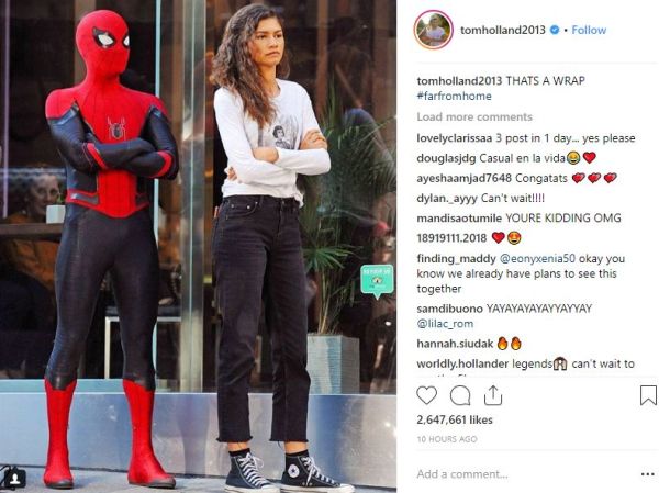 Spider-Man and Michelle standing together with arms crossed