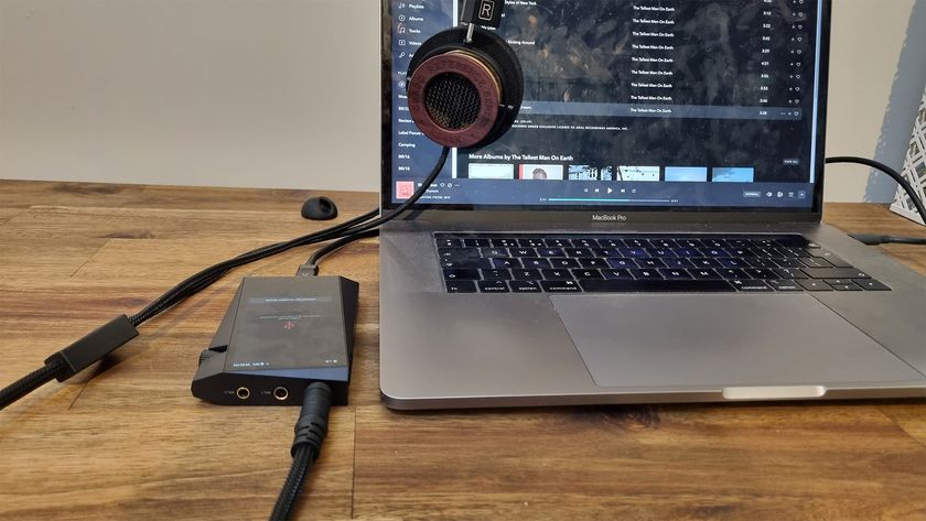 Astell &amp; Kern A&amp;norma SR35 plugged into a laptop and headphones