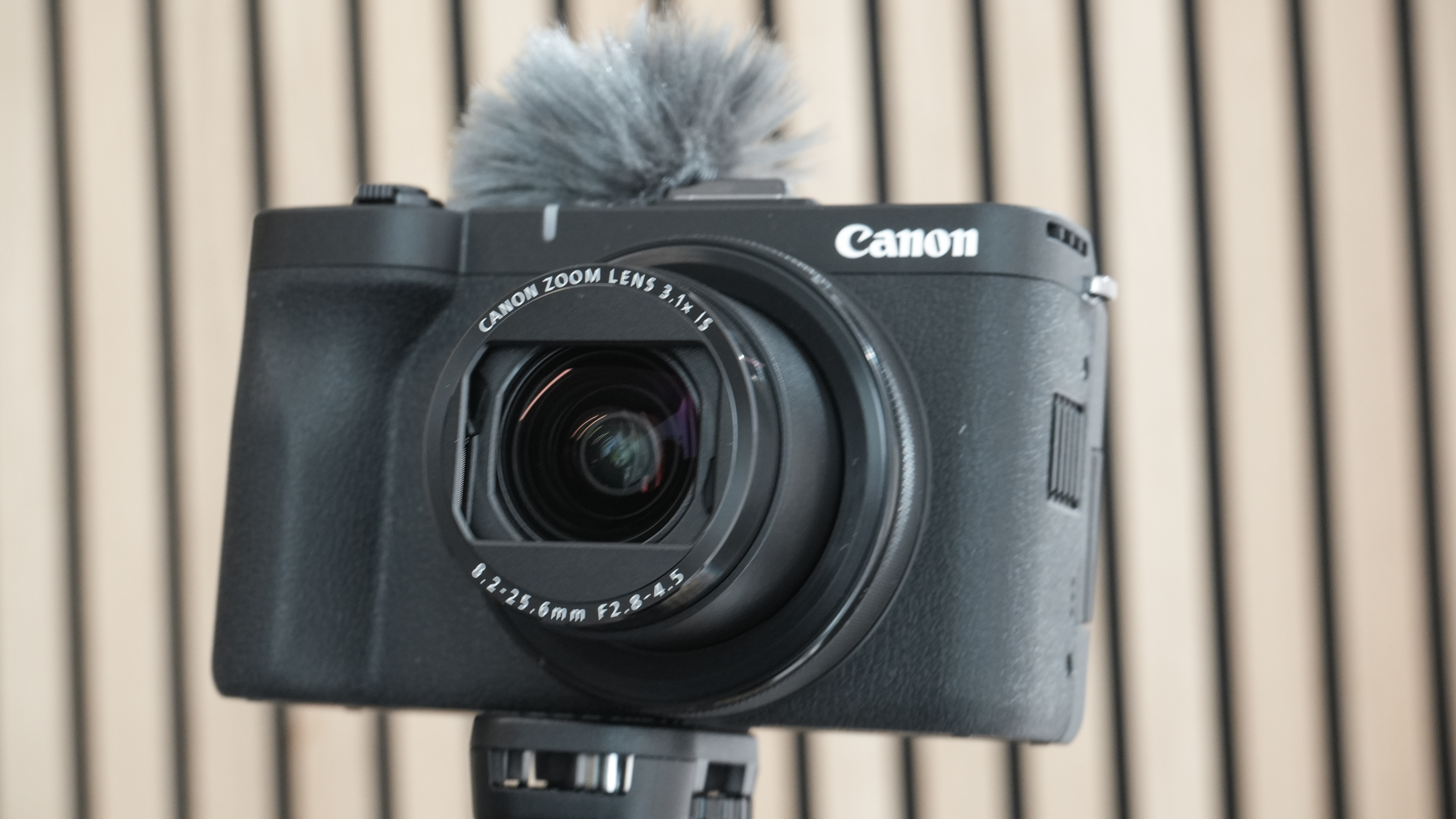 Canon PowerShot V1 being held in man's hand