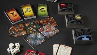 Cards and tiles from Betrayal at Baldur's Gate on a dark surface