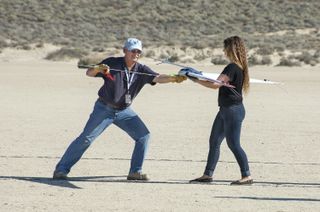 Al Bowers (left) attaches a bungee cord to the Prandtl-d glider — the forerunner of a Mars glider concept known as Prandtl-m — as Kassidy McLaughlin (right) prepares to release and launch the aircraft during a test.