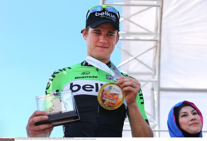Theo Bos shows off his winner's trophies