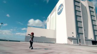 Violinist, composer and dancer Lindsey Stirling performs her new song "Artemis," named after NASA's new moon-landing program, at the agency's Kennedy Space Center in Florida.