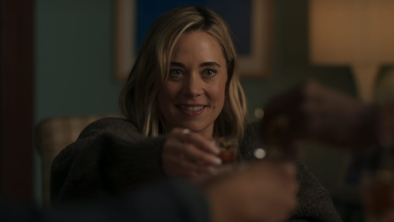 Erika Henningsen raising a glass at the end of The Four Seasons