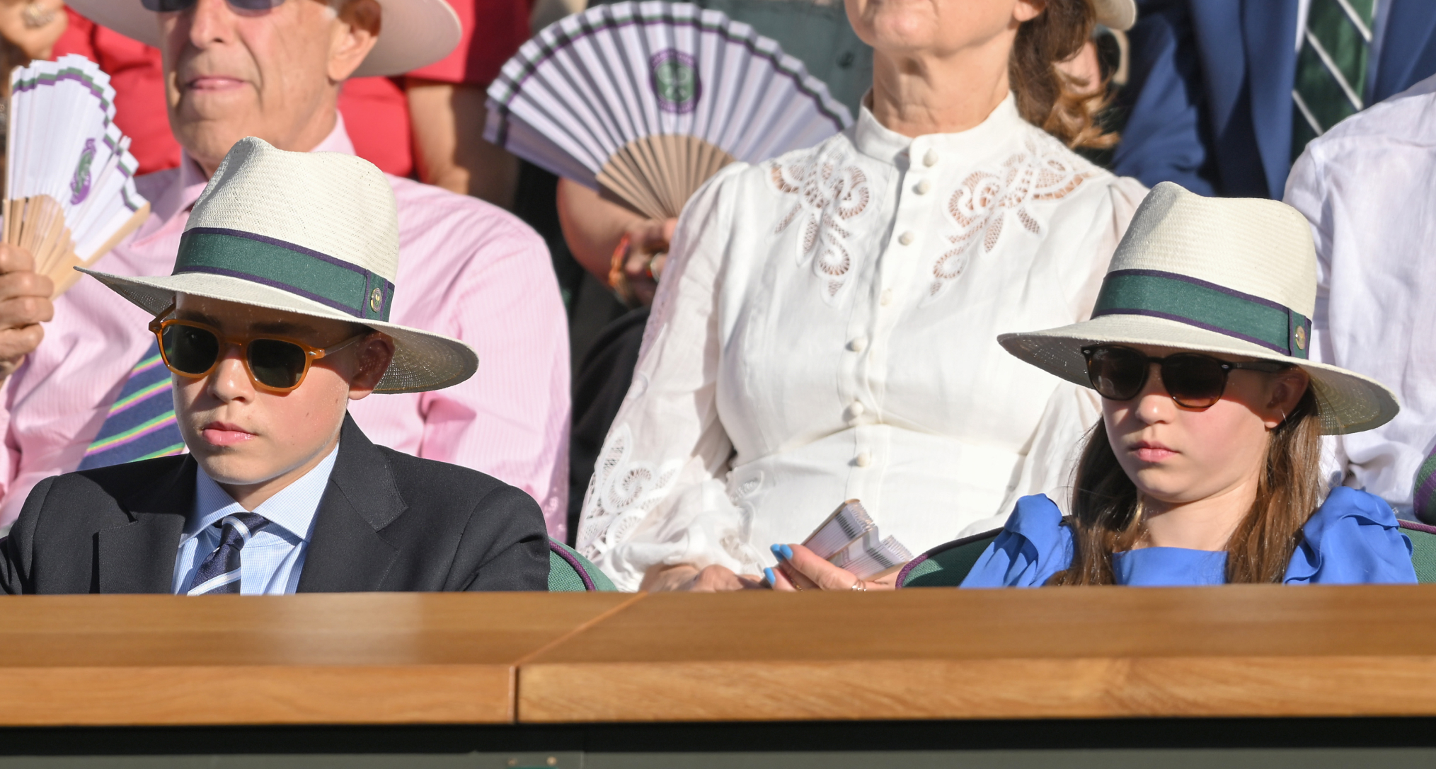 Prince George and Princess Charlotte wearing sun hats at Wimbledon