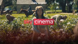 A Sky Cinema logo in front of a movie screenshot of a woman in a field