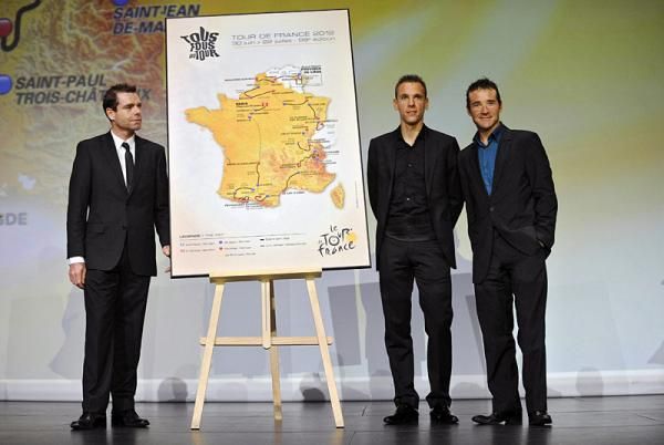 Three of the stars of the 2011 Tour de France, Cadel Evans, Philippe Gilbert, and Thomas Voeckler, with the 2012 Tour route.