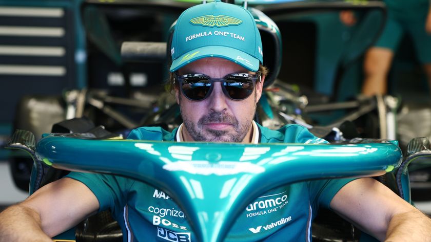 MONZA, ITALY - SEPTEMBER 04: Fernando Alonso of Spain and Aston Martin F1 Team has a seat fit in the garage during previews ahead of the F1 Grand Prix of Italy at Autodromo Nazionale Monza on September 04, 2025 in Monza, Italy. (Photo by Zak Mauger/LAT Images)