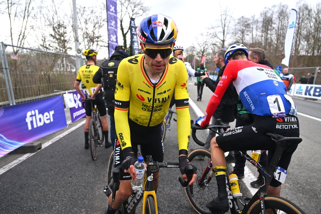 NINOVE BELGIUM FEBRUARY 24 LR Wout Van Aert of Belgium and Dylan Van Baarle of Belgium and Team Visma Lease A Bike react after the 79th Omloop Het Nieuwsblad 2024 Mens Elite a 2022km one day race from Ghent to Ninove UCIWT on February 24 2024 in Ninove Belgium Photo by Luc ClaessenGetty Images