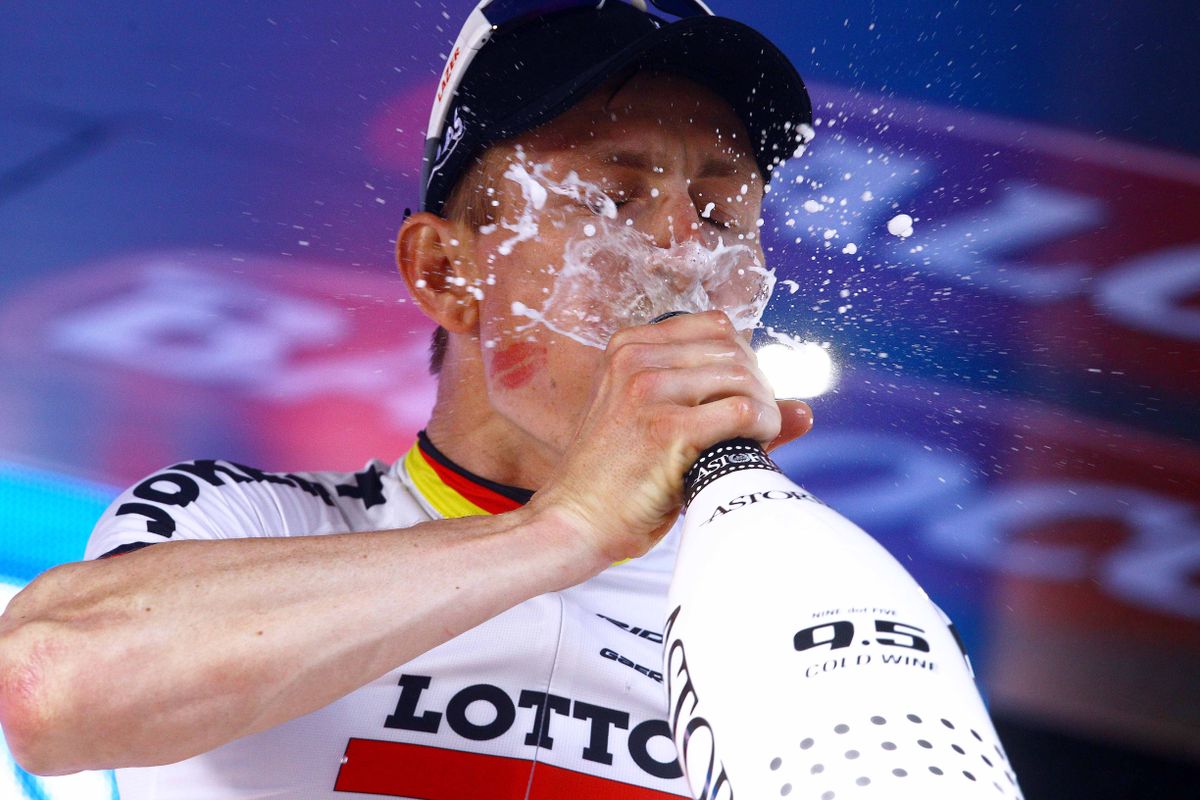 Andr&eacute; Greipel (Lotto Soudal) gets a big mouthful of prosecco