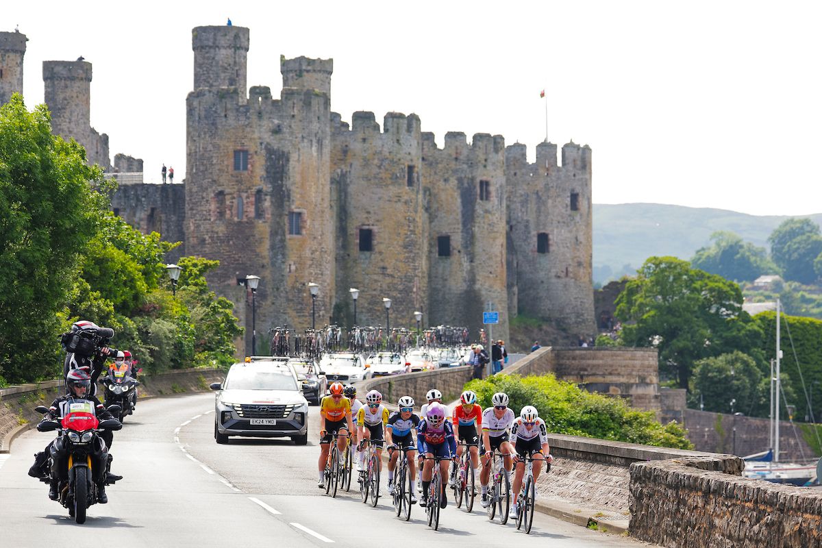 Picture by Alex Whitehead/SWpix.com - 06/06/2024 - Cycling - UCI Women's World Tour - Lloyds Bank Tour of Britain Women - Stage 1: Welshpool to Llandudno, Wales - The breakaway passing Conwy Castle