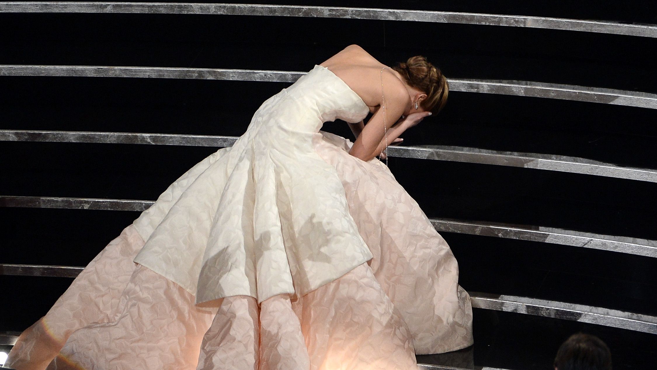 Dress, Fashion, Wedding dress, Gown, Bridal clothing, Performance, Performance art, Event, Human body, Hand,