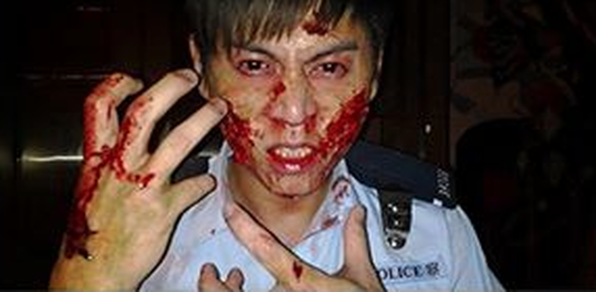 Hong Kong official shares fake photo of beaten-up cop