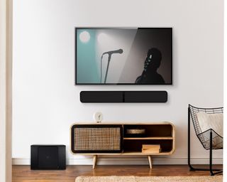 Wall mounted soundbar underneath a TV