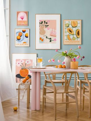 A dining room with a dining set and wall art