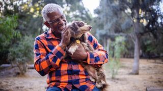 Man petting dog