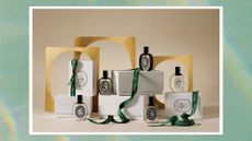 A selection Diptyque perfume bottles and boxes with green ribbons on a green holographic background