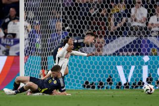 Ryan Christie of Scotland, Jamal Musiala of Germany, Kieran Tierney of Scotland during the EURO match between Germany v Scotland at the Allianz Arena on June 14, 2024 in Munich Germany (Photo by Rico Brouwer/Soccrates/Getty Images)