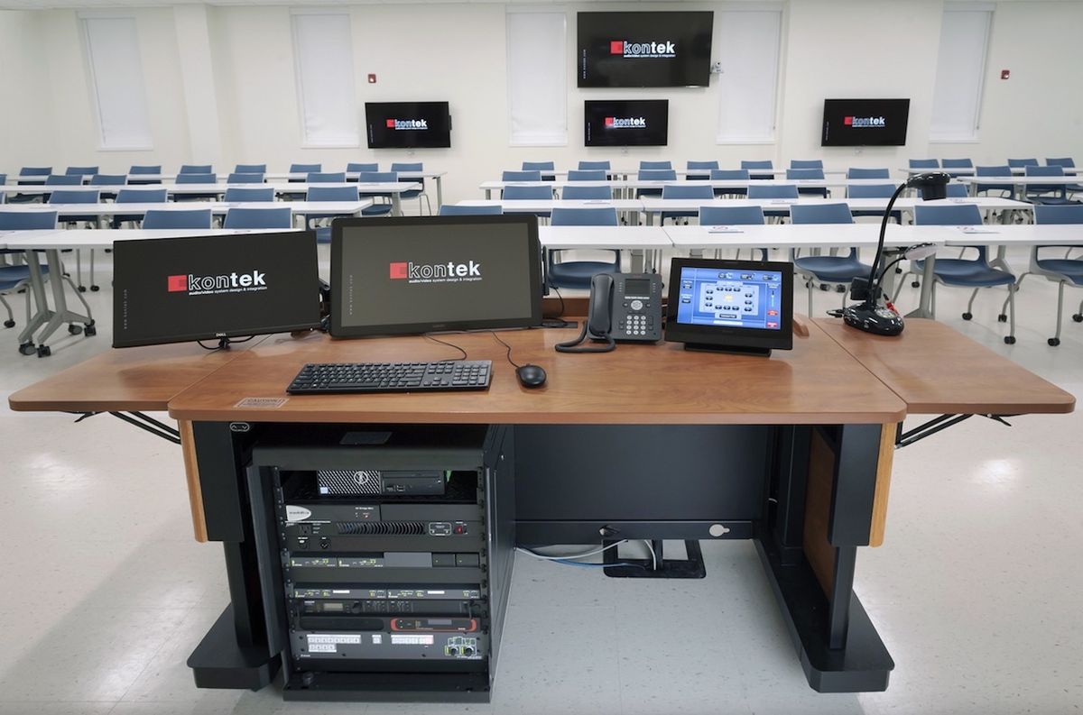 Rack-mounted within the instructor lectern located in each active learning and traditional classroom is the AV system. It includes NAV E 101 encoders and NAV SD 101 scaling decoders. Additional scaling decoders are mounted to the two projector lifts.