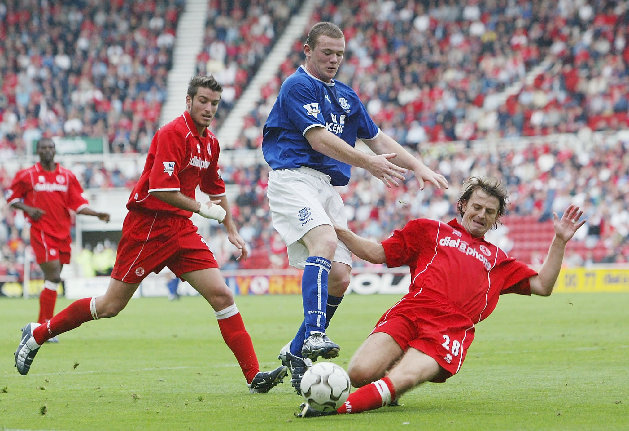 MIDDLESBROUGH, ENGLAND - SEPTEMBER 21: Wayne Rooney of Everton battles with Colin Cooper of Middlesbrough during the FA Barclaycard Premiership match between Middlesbrough and Everton at The Rivedrside Stadium on September 21, 2003 in Middlesbrough, England. (Photo by Laurence Griffiths/Getty Images)