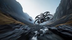 DJI Avata 2 review: drone at speed flying in a valley