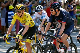 PARIS FRANCE JULY 18 Tadej Pogaar of Slovenia and UAETeam Emirates yellow leader jersey Geraint Thomas of The United Kingdom and Team INEOS Grenadiers during the 108th Tour de France 2021 Stage 21 a 1084km stage from Chatou to Paris Champslyses LeTour TDF2021 on July 18 2021 in Paris France Photo by Chris GraythenGetty Images