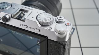 A Fujifilm X-M5 mirrorless vlogging camera in the silver colorway