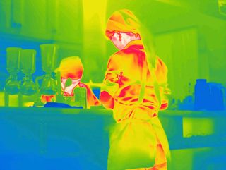 Heat map style photograph of waiter in restaurant.