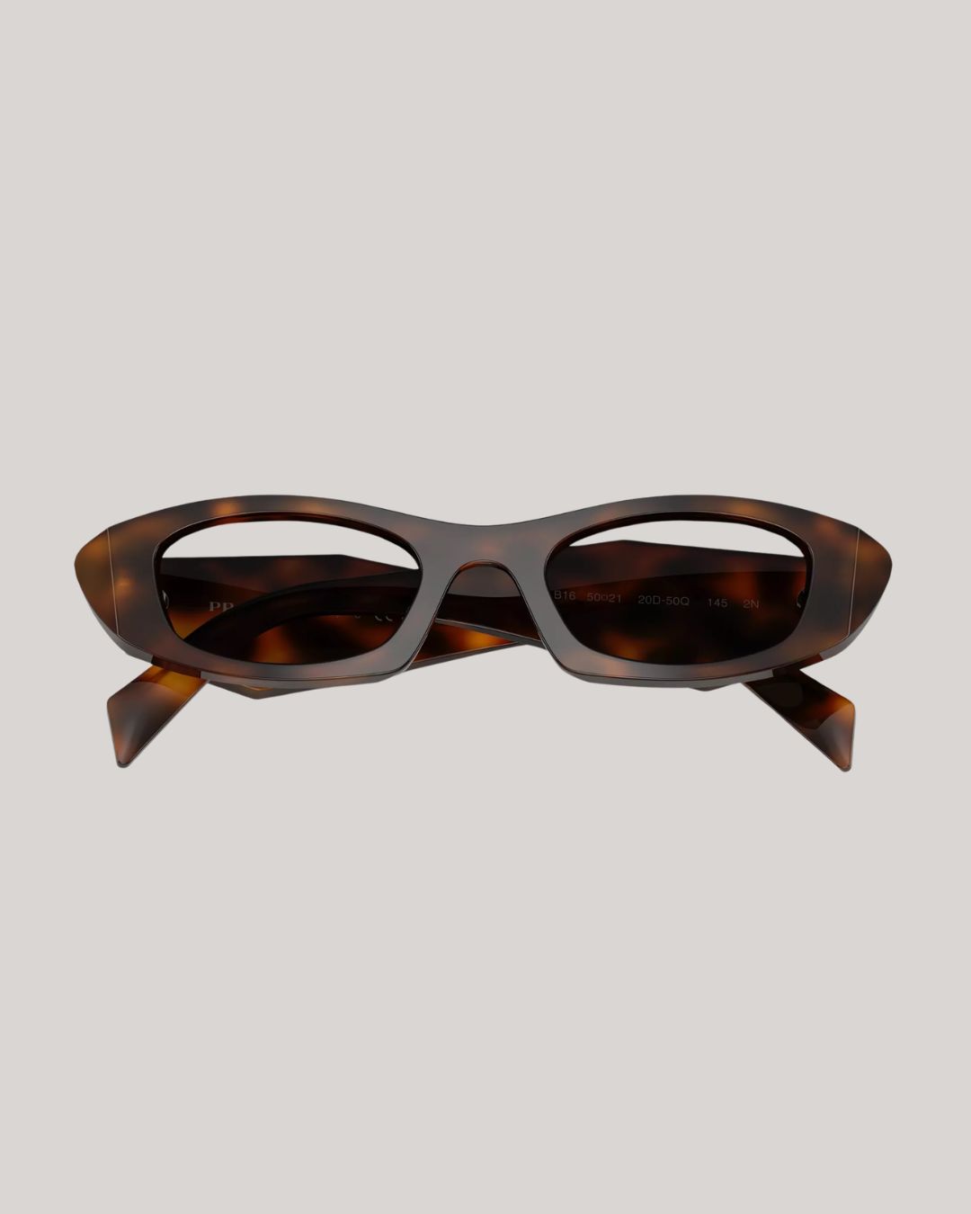 Geometric Sunglasses against pale beige background.