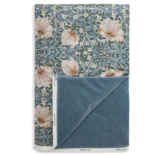 Blue Pimpernel Quilted Throw with a blue velvet backing