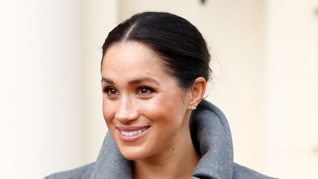 Meghan Markle wears pearl earrings and sleek bun to surprise pregnant women