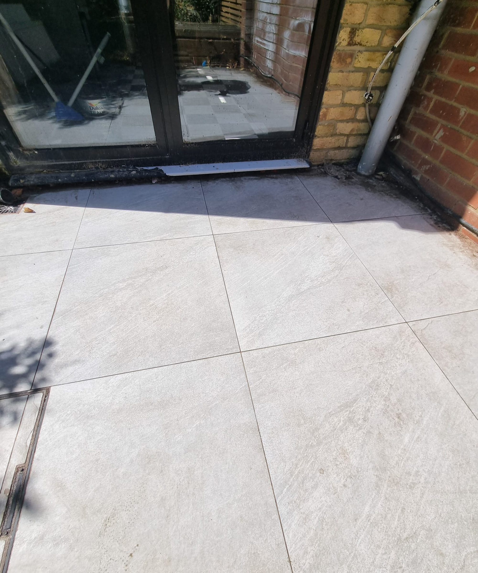 After shot of clean patio slabs in porcelain light grey colour
