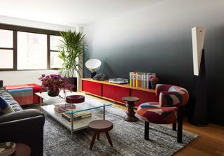 a living room with an ombre wall covering