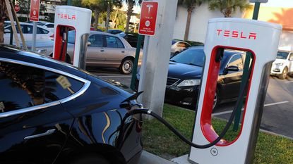EV car charging at Tesla Supercharger station