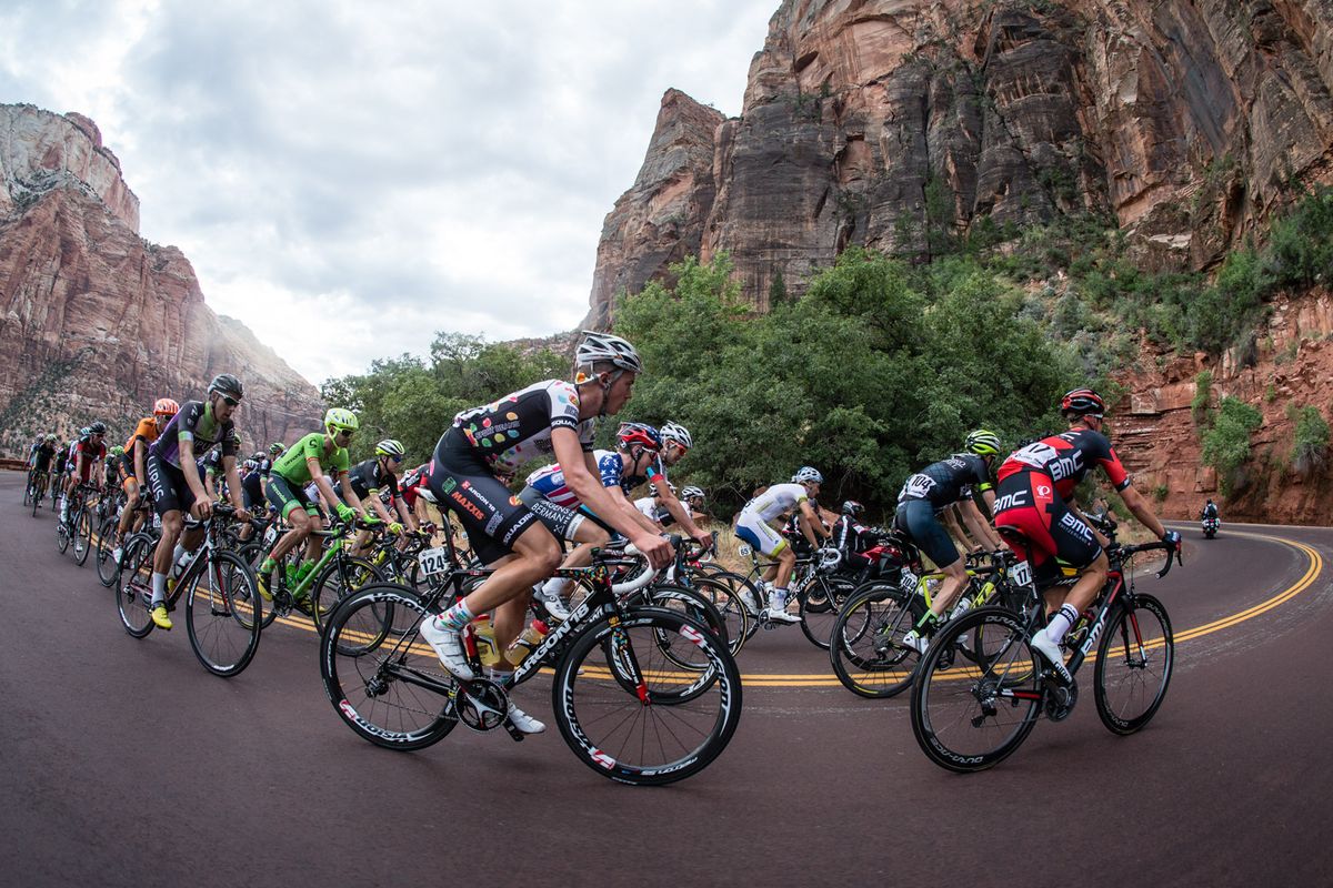 Riders round a corner through Zion National Park