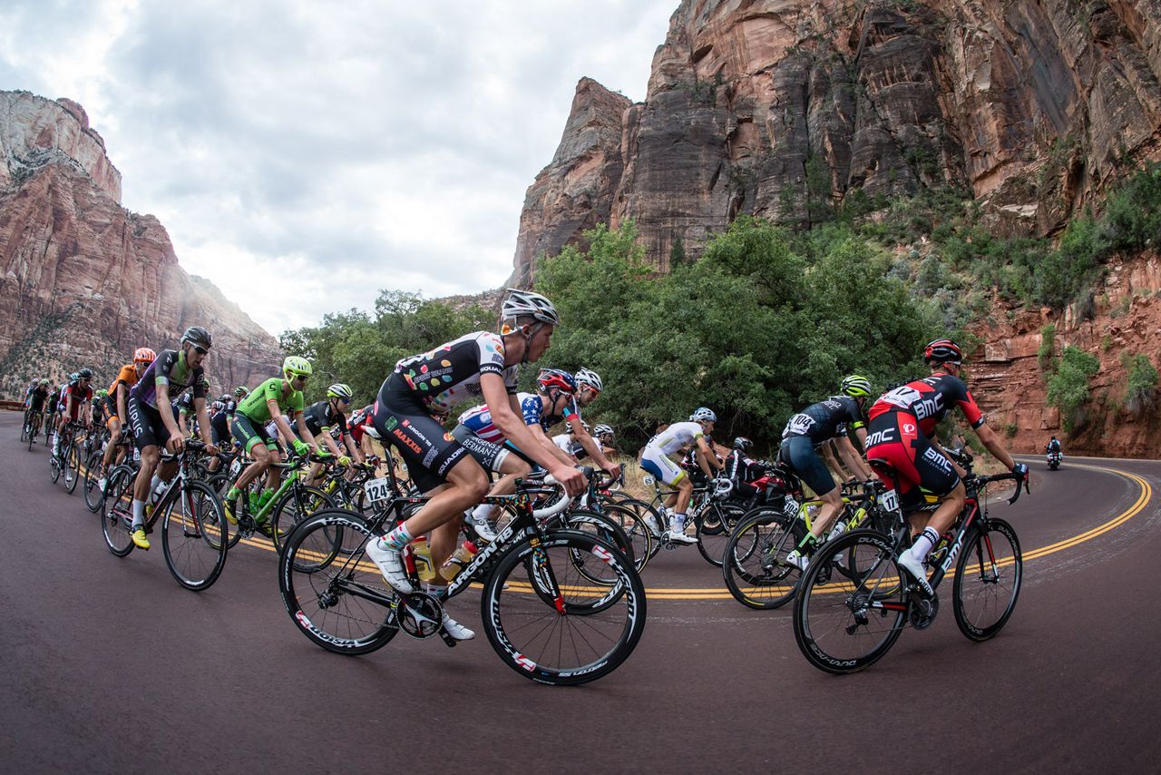 Riders round a corner through Zion National Park