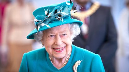 Queen Elizabeth II smiles during a visit to the Edinburgh Climate Change Institute, as part of her traditional trip to Scotland for Holyrood Week on July 1, 2021 in Edinburgh, Scotland