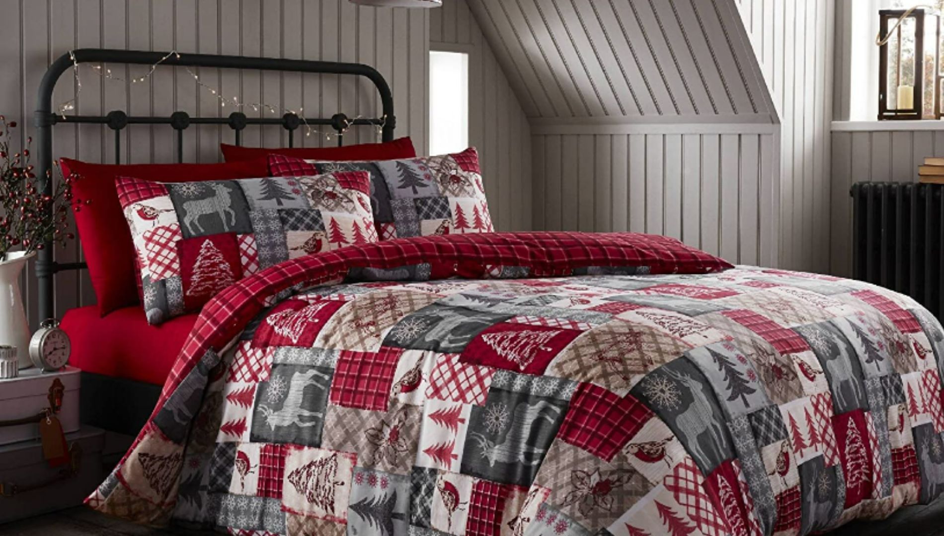 A patchwork style Christmas bedding set on a double bed.