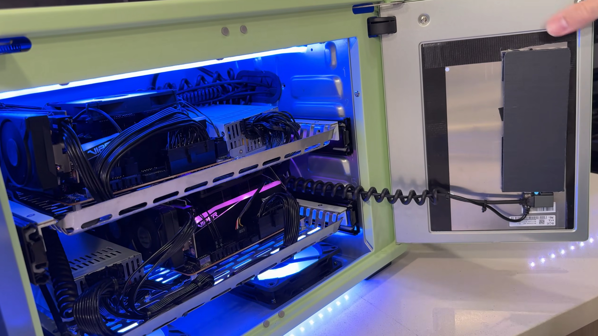 A SignalRGB do-gaming PC air fryer with its doors open.