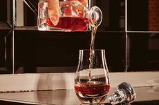 The Last Call cocktail, a popular after-dinner choice on the list of the American Bar at The Savoy, being poured into a glass