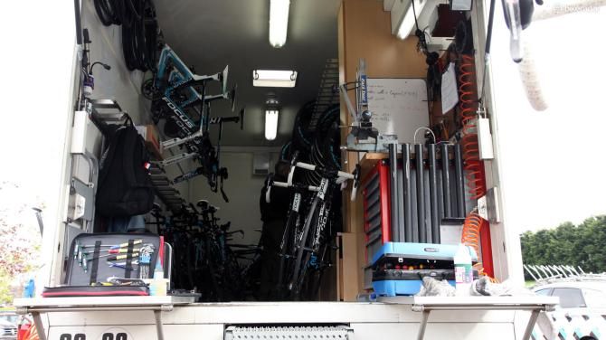 Vises serve double duty as truing stand mounts for the Ag2r-La Mondiale team so that mechanics don't have to carry dedicated bases. Check out how spare inner cables are stored, too